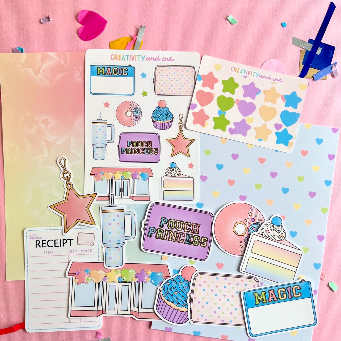 Colorful stationery items including stickers and a planner on a pink background