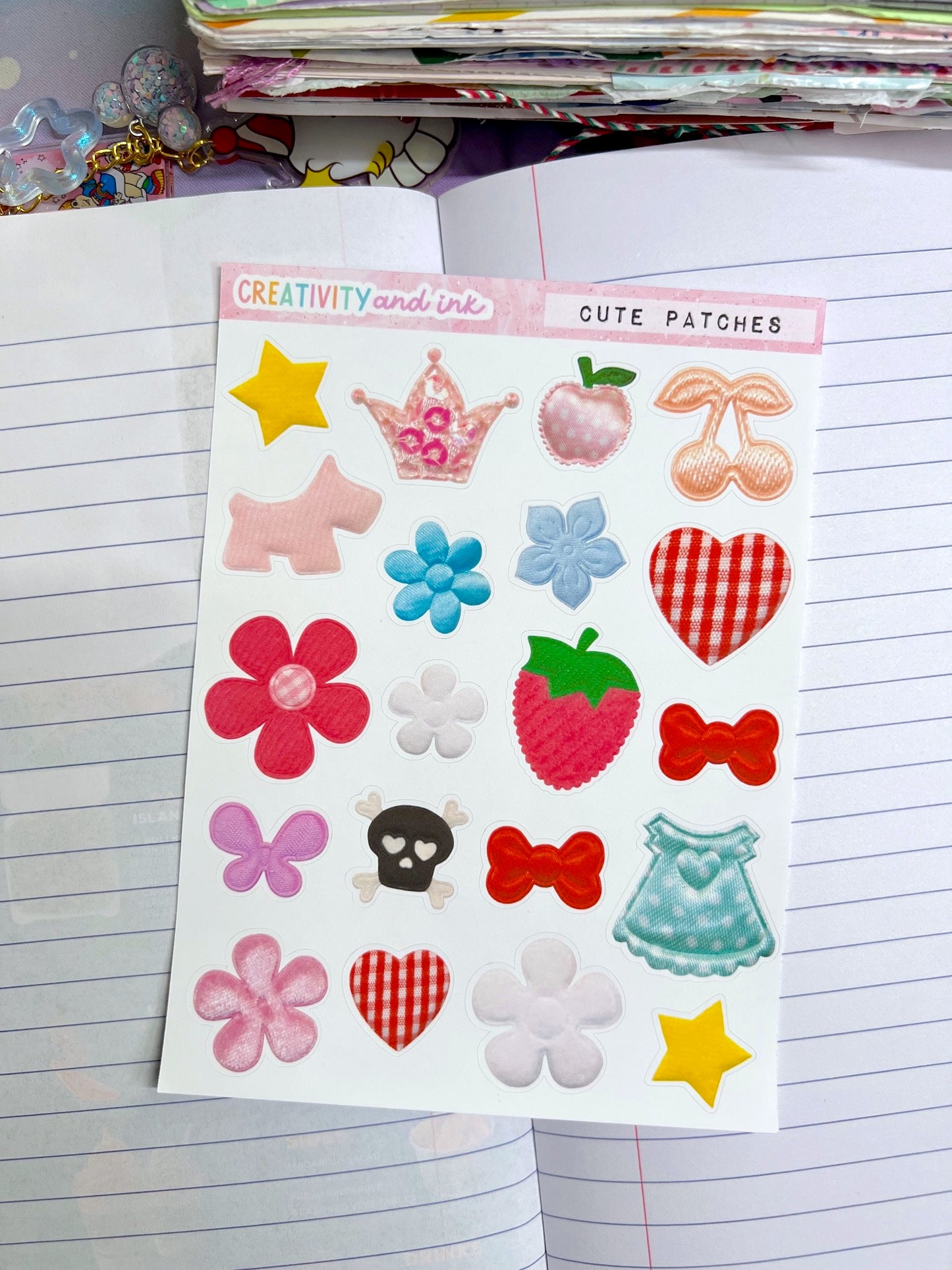Sheet of colorful patches with various designs on a notebook page.