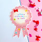 Decorative sticker with 'Junk Journal Babe' text on a pink background with colorful confetti.