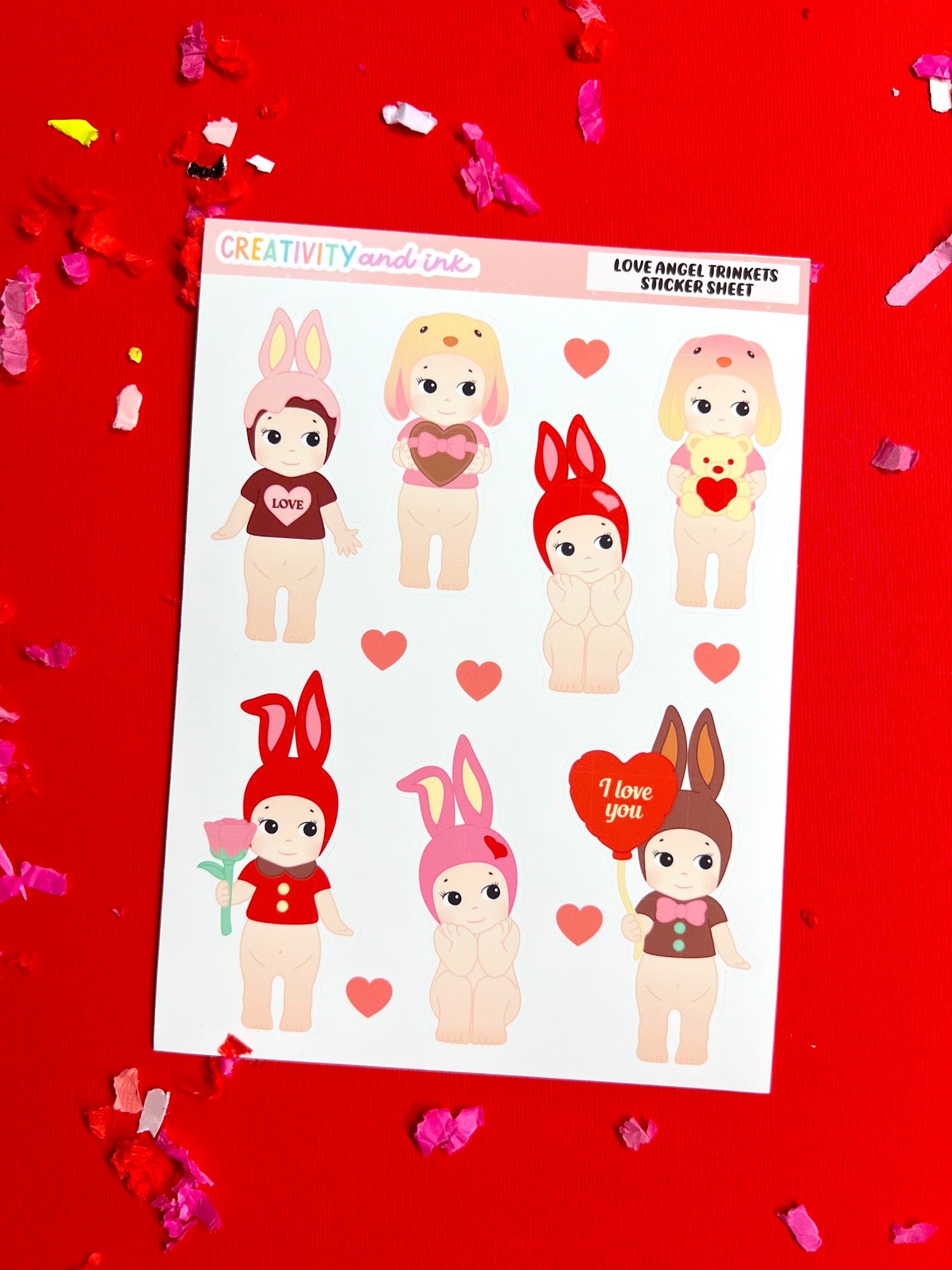 Sheet of cartoon character stickers on a red background with confetti