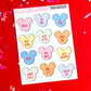 Sheet of decorative stickers with cartoon faces and phrases on a red background