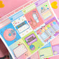 Colorful planner stickers with various designs on a pink background