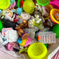Assorted colorful plastic toys and items on a surface