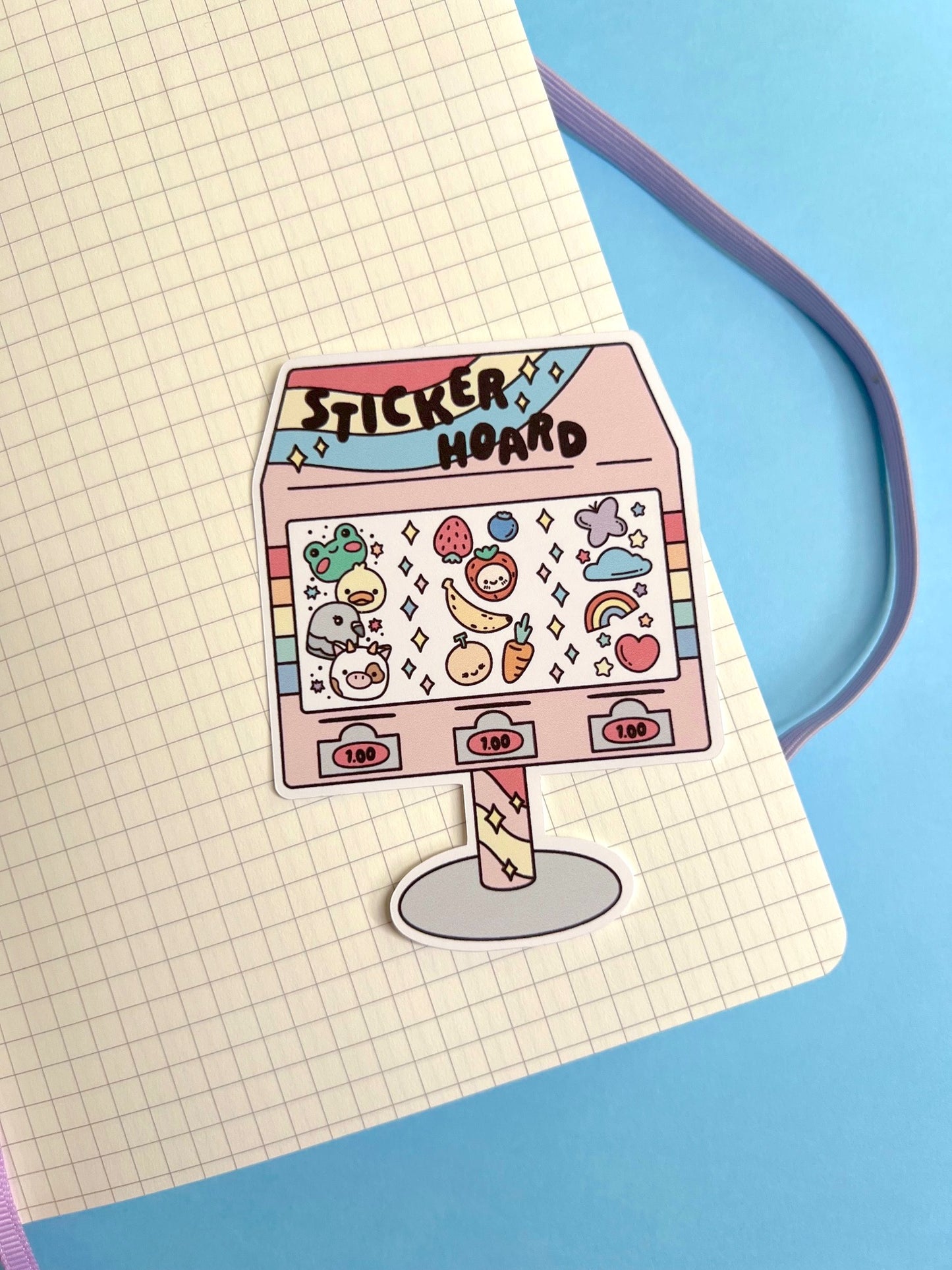 Sticker vending machine sticker on a notebook page with a blue background