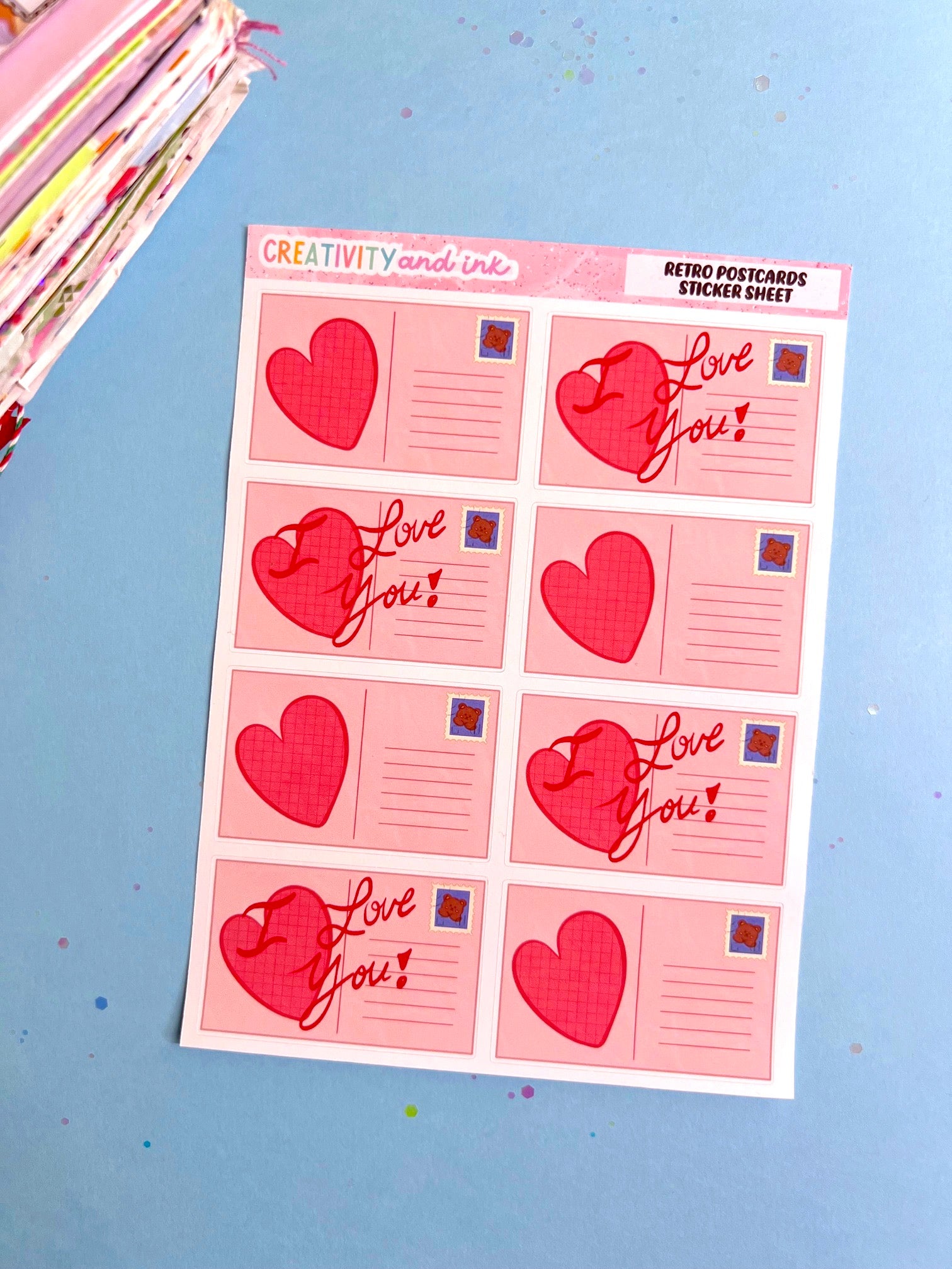 Sheet of 'I Love You' and heart-shaped stickers on a blue background