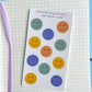 mini smiley faces as a sticker sheet on a notebook background 