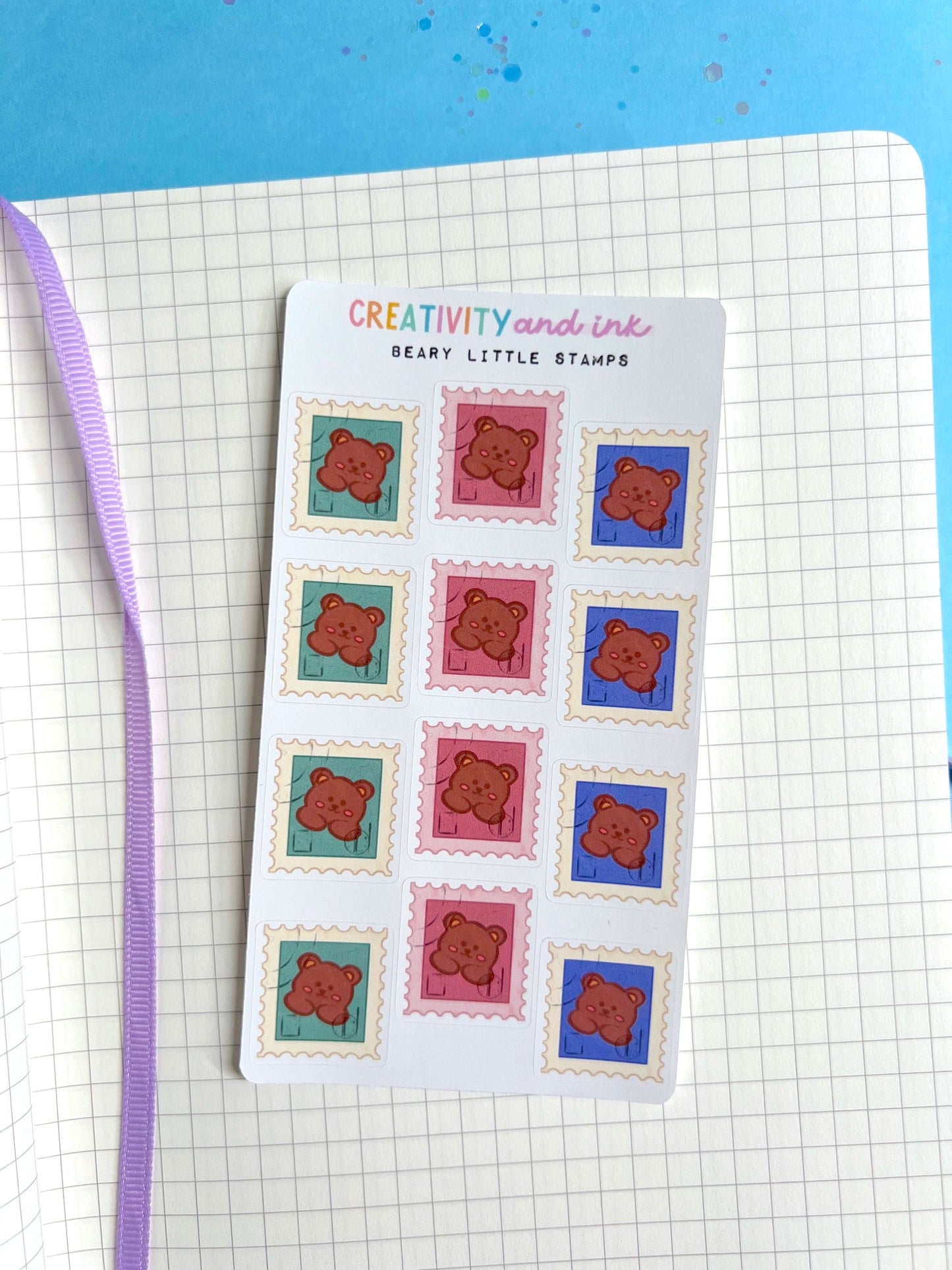 mini little stamp stickers that have a bear on them as a sticker sheet on a notebook background