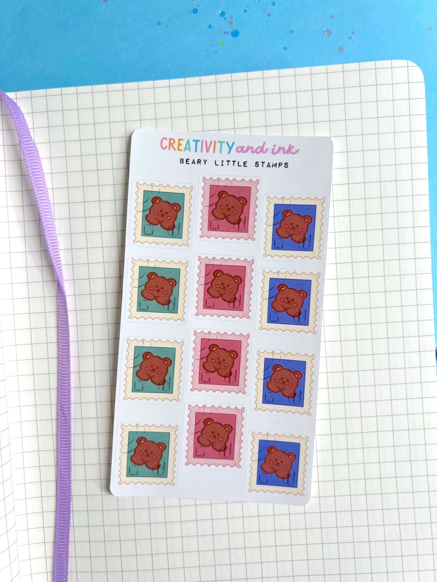 mini little stamp stickers that have a bear on them as a sticker sheet on a notebook background
