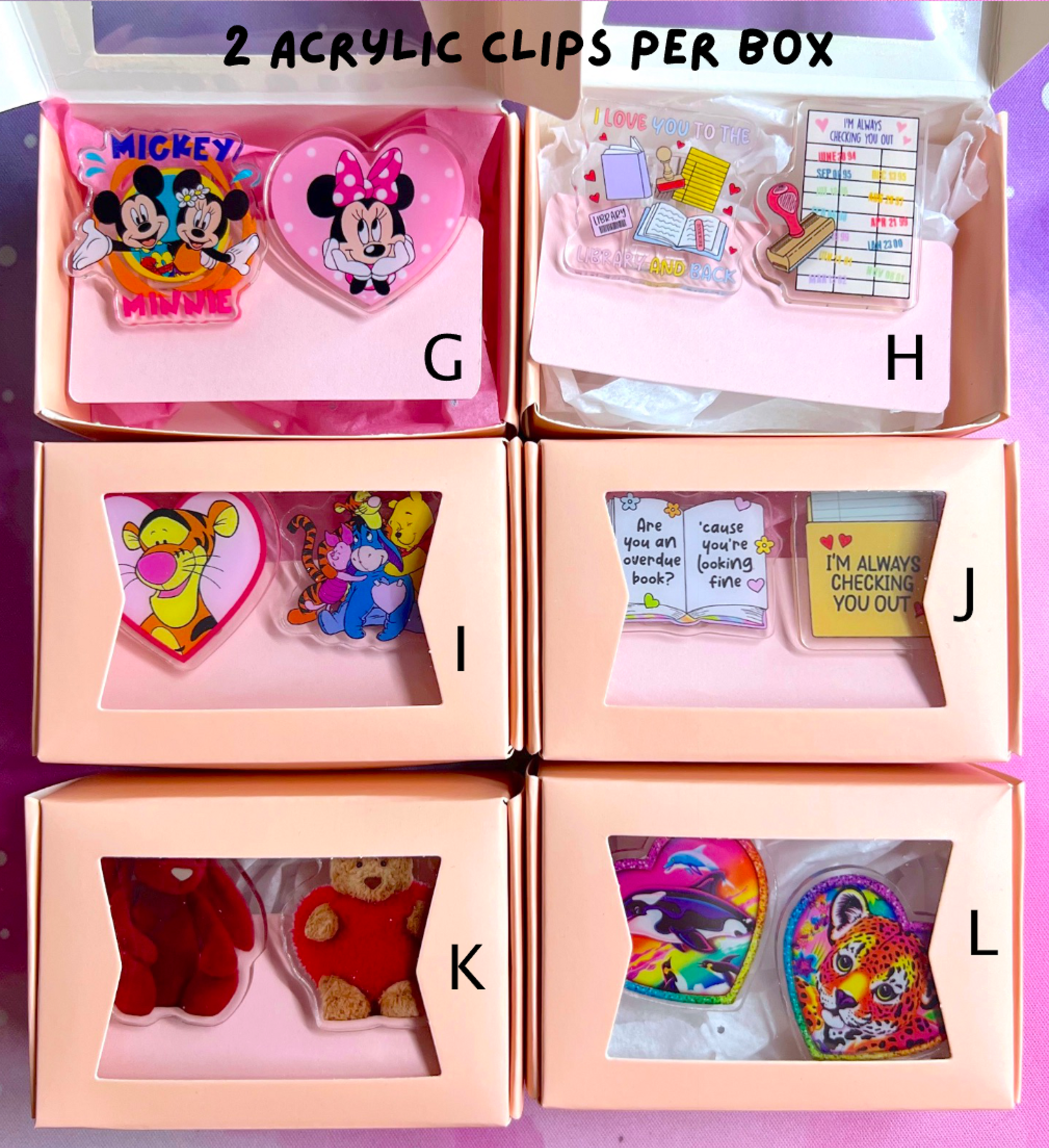 Set of acrylic clips in clear boxes with colorful designs and text.